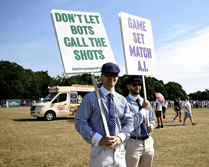 well dressed men in khakis protest AI at Whimbledon tennis London