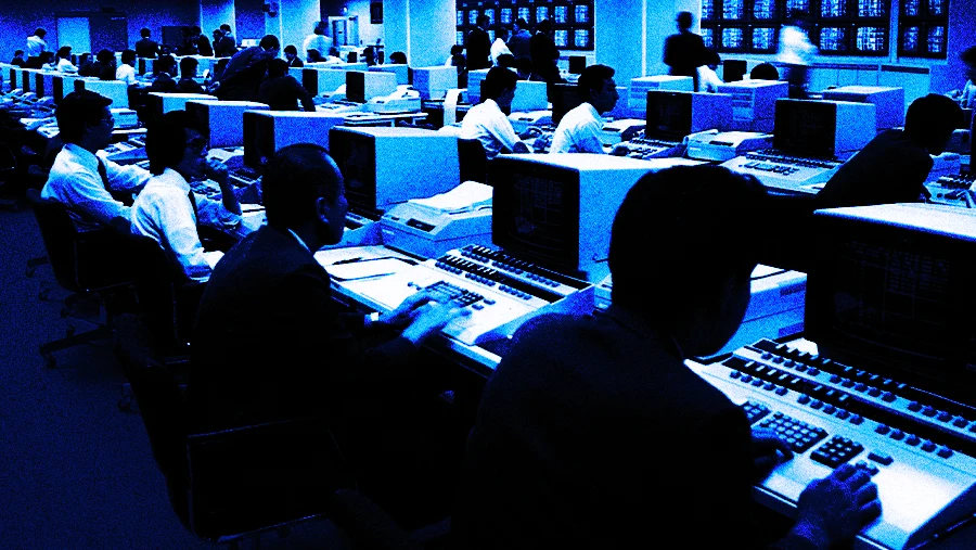 chaotic office floor with agents on computers