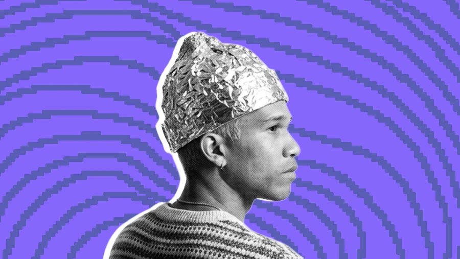 man wearing tinfoil beanie hat on wavy pixel background